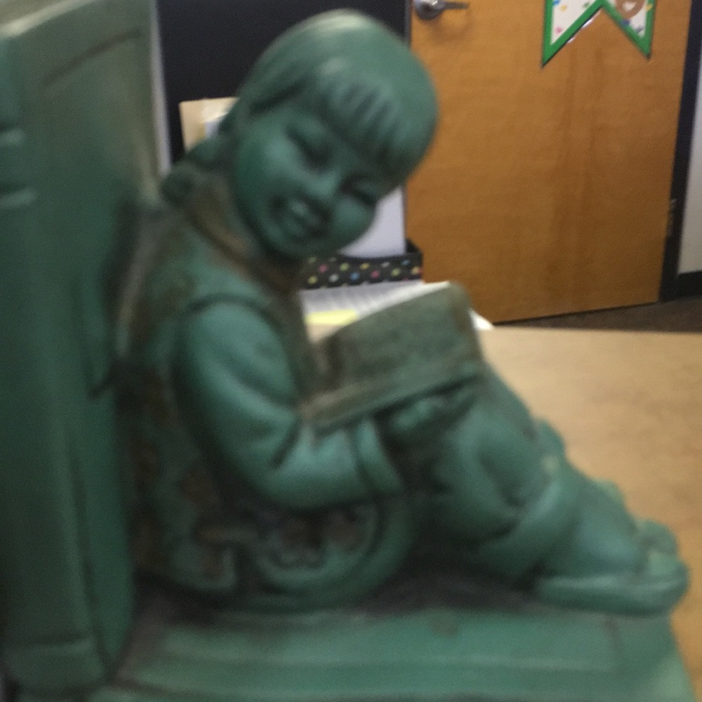 A lil Chinese boy on some books